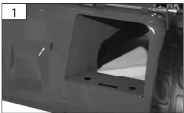 Close-up of a white plastic panel with a recessed opening and mounting holes (no visible text or symbols)