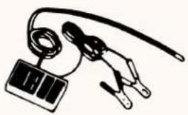 Simple line drawing of a clamp holding a small electronic device (no text or symbols)