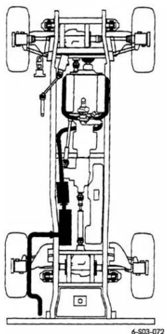 Technical line drawing of a vehicle chassis with four wheels and internal components (no text or symbols)