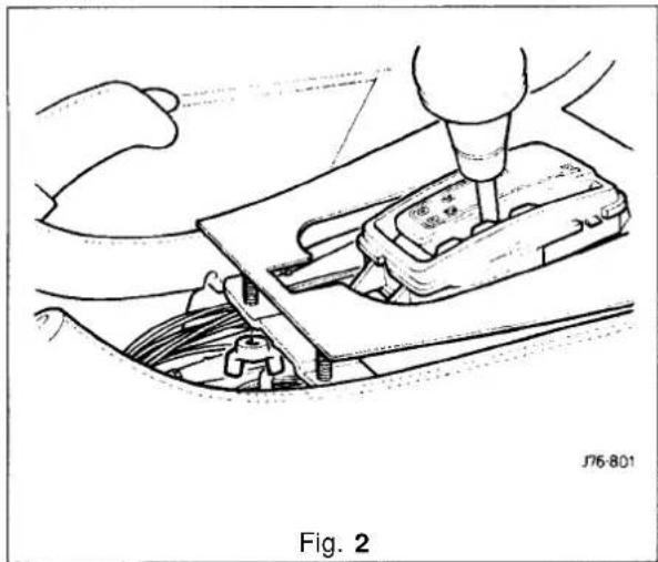 Technical line drawing of a mechanical assembly with hands and tools (no text or symbols)