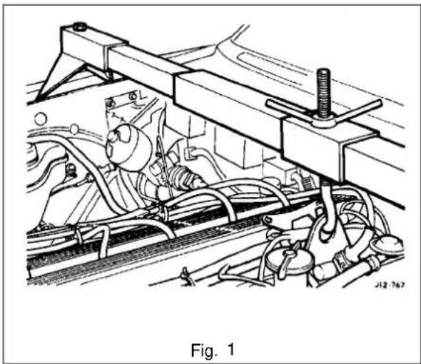 Technical line drawing of a mechanical assembly with hoses and components (no text or symbols)