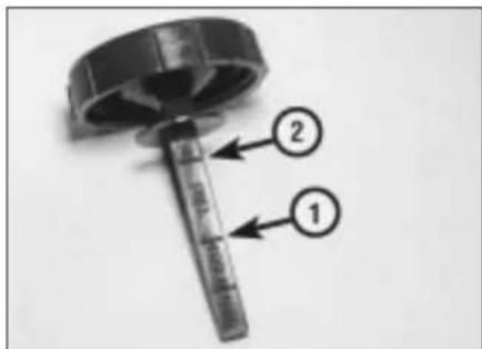 Diagram of a mechanical component with labeled parts 1 and 2, showing internal structure and directional arrows.