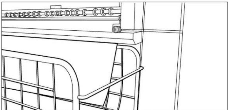 Line drawing of a mechanical assembly with rollers and a metal frame (no text or symbols)