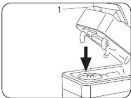 Diagram of a mechanical device with a downward arrow indicating a process or operation (no text or symbols present)