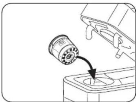 Diagram showing a mechanical component with a rotating component and an arrow indicating direction (no text or symbols)