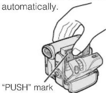 Automatically. "PUSH" mark