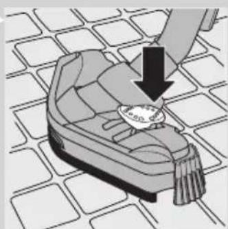 Illustration of a small slipper on a tiled floor with a downward arrow indicating motion (no text or symbols)