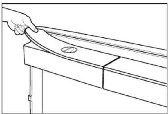 Line drawing of a hand pressing down on a curved wooden beam or bracket (no text or symbols)