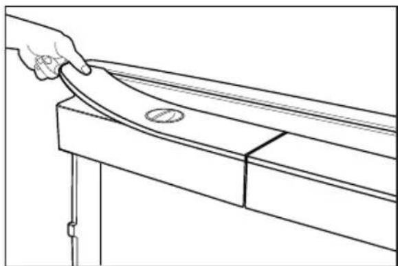 Line drawing of a hand holding a curved object on a wooden beam, with no text or symbols present.