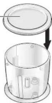 Diagram of a cylindrical container with internal components and an upper lid, showing no text or symbols.