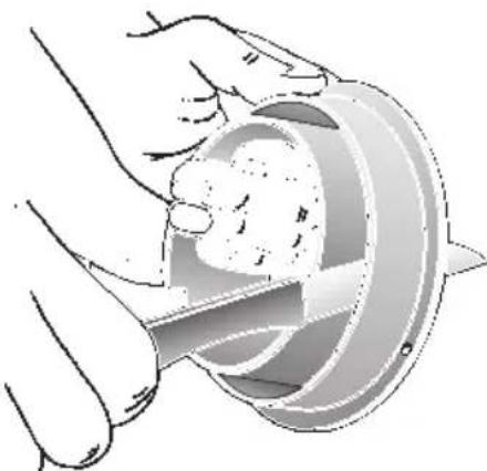 Illustration of hands using a tool to cut a circular object with a handle (no text or symbols visible)
