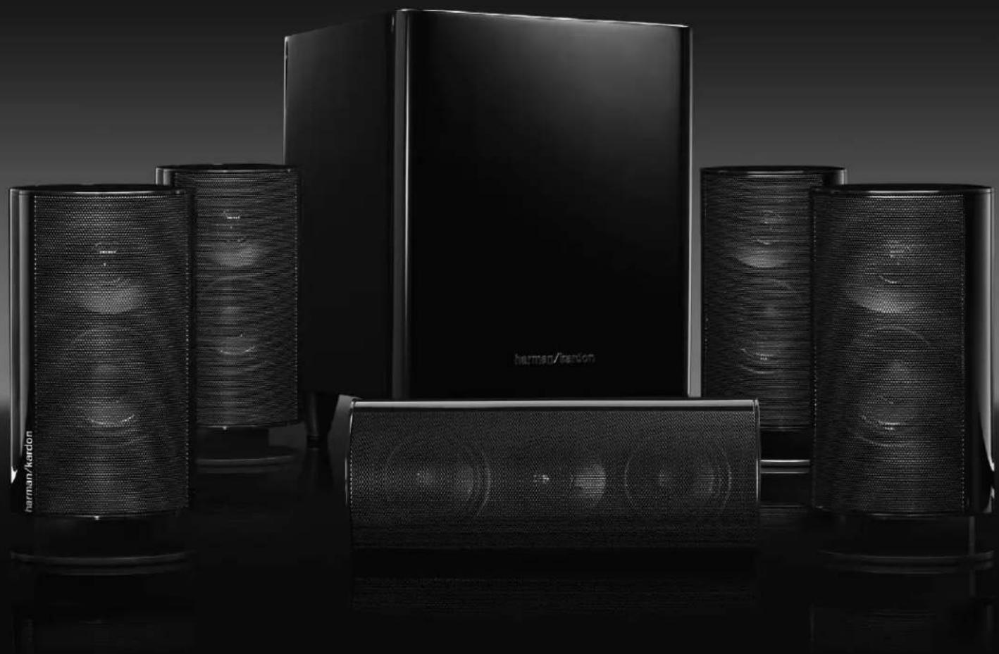 Black-and-white product photo of a modern audio amplifier with multiple speakers and a large screen (no visible text or symbols)