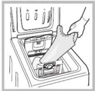 Illustration of a hand inserting a plastic bag into a shared appliance inside a washing machine (no text or symbols visible)