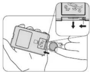 Diagram showing a hand inserting a device into a device with an icon and directional arrow, alongside a close-up of the device's internal components.