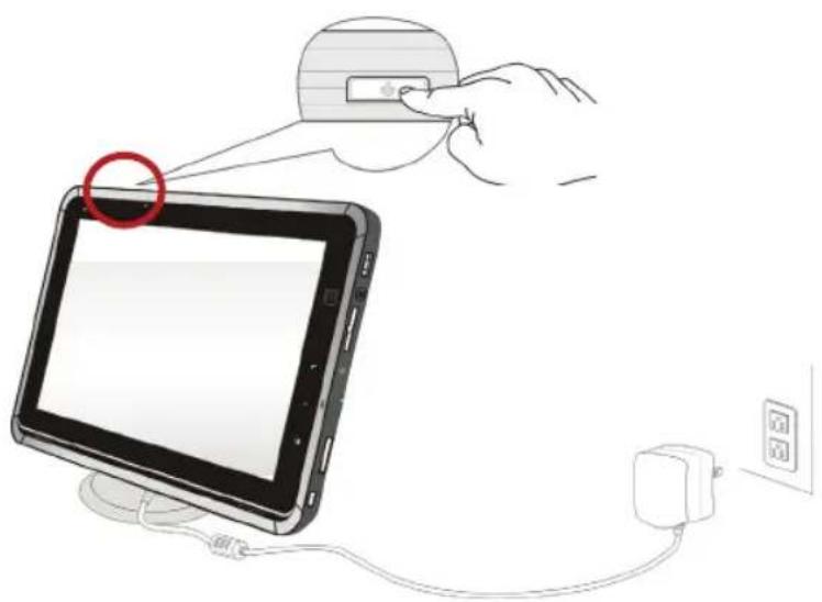 Diagram showing a hand inserting a device into a tablet, with a red circle highlighting the device's tip and connected to a power outlet.