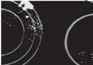 Abstract circular patterns with scattered dots on a dark background, no text or symbols present.