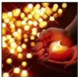 Close-up of a hand holding a lit candle with golden bokeh light effects (no text or symbols)