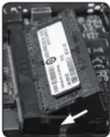 Close-up of a computer RAM module with visible branding and an arrow pointing to it, indicating a component or feature.