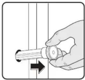 Hand holding a mechanical component with an arrow indicating direction (no text or symbols)
