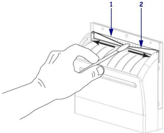 Diagram showing a hand using a device to press or install a tray, labeled with arrows indicating process steps.
