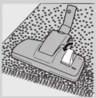Illustration of a mechanical tool or device on a textured surface, no text or symbols visible.
