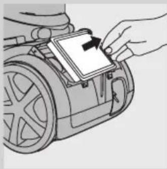 Illustration of a hand inserting a component into a car's steering wheel (no text or symbols).