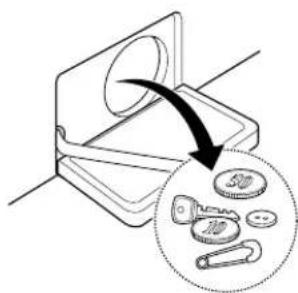 Diagram illustrating a mechanical device with a magnified view of coins and parts, showing a transformation or assembly process.