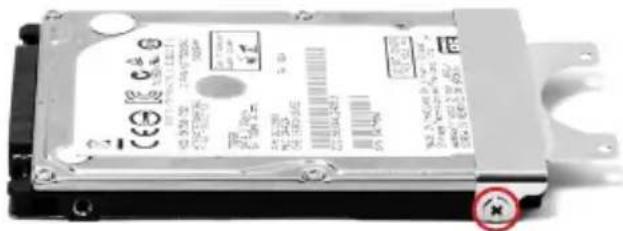 Close-up of an internal hard drive (HD drive) with visible printed labels and a warning symbol
