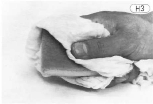 Close-up of hands holding a piece of dough with visible filling (no text or symbols)