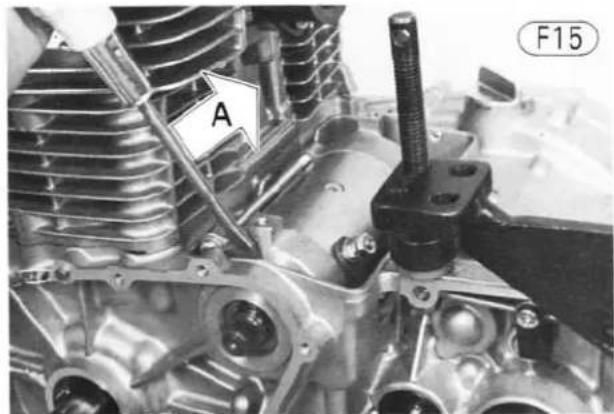 Close-up of an internal combustion engine cylinder with a labeled component 'A' and part identifier 'F15' (no readable text beyond labels)