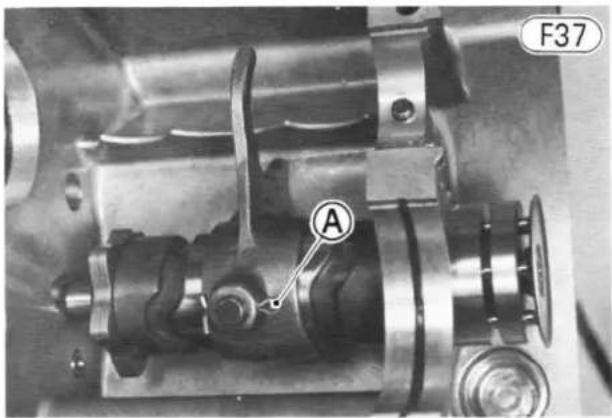 Close-up mechanical assembly with labeled component A and F37 marker (no readable text or symbols beyond labels)