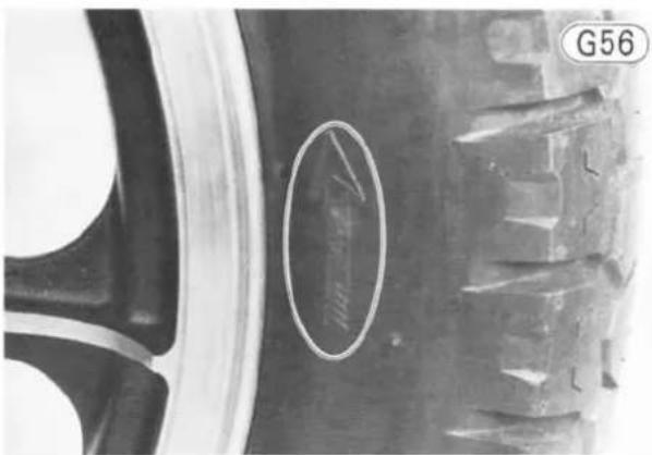 Close-up of a tire wheel with a circular mark and label G56 (no readable text or symbols beyond the label)