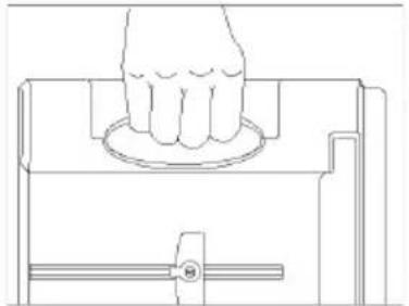 Line drawing of a hand pressing down on a circular component, with no text or symbols present