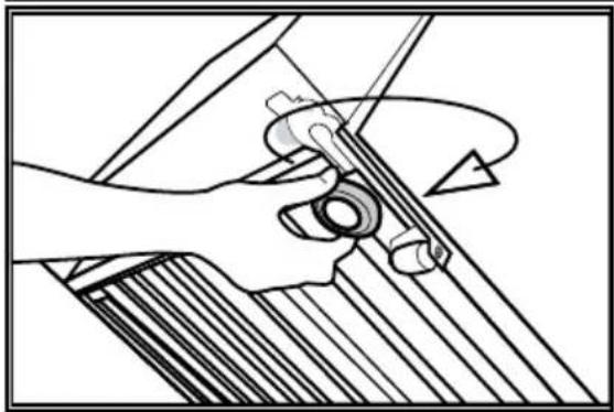 Mechanical assembly diagram showing a hand operating a tool with a circular component (no text or symbols)