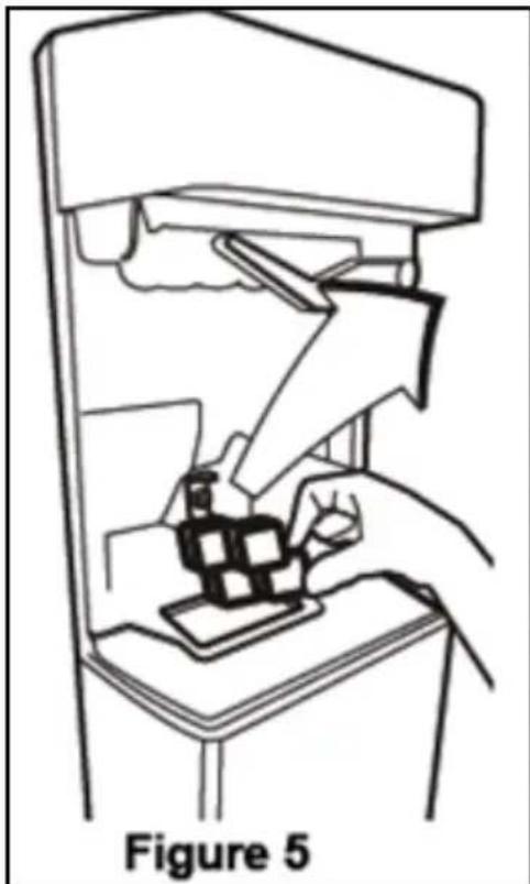 Line drawing of a hand using a tool to interact with a device, labeled Figure 5 (no text or symbols on the diagram itself).