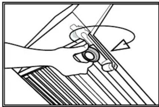 Mechanical diagram showing a hand operating a tool with a circular component, no text or symbols present.