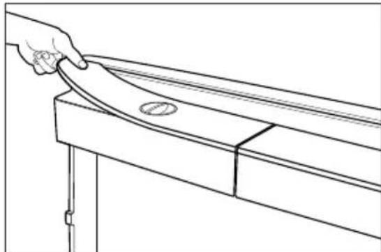 Line drawing of a hand holding a curved object on a wooden beam, with no text or symbols present.