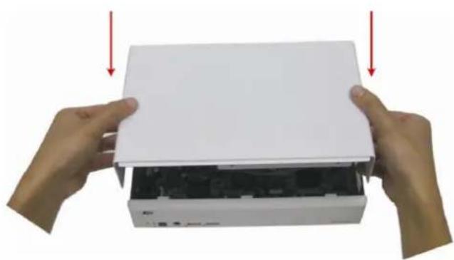 Two hands holding a white electronic device with a black internal structure, no visible text or symbols