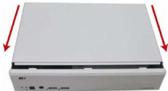 Front view of a white electronic device with red arrows pointing to its side (no visible text or symbols)
