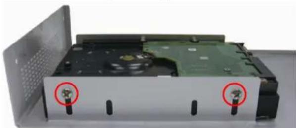 Exterior view of a computer DVD drive showing internal components and mounting holes (no text or symbols visible)