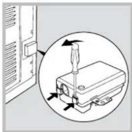 Diagram showing a screwdriver inserted into a device component, with arrows indicating direction (no text or symbols present)
