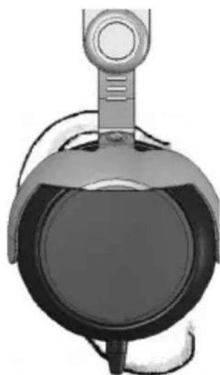 Top-down view of a black and white object resembling a helmet or device with a circular body and handle (no visible text or symbols)