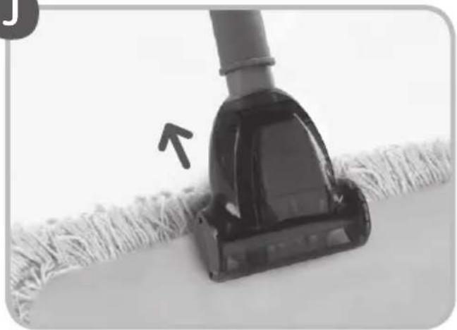 Close-up of a vacuum cleaner on a textured surface, with an arrow pointing to the blade (no text or symbols visible)