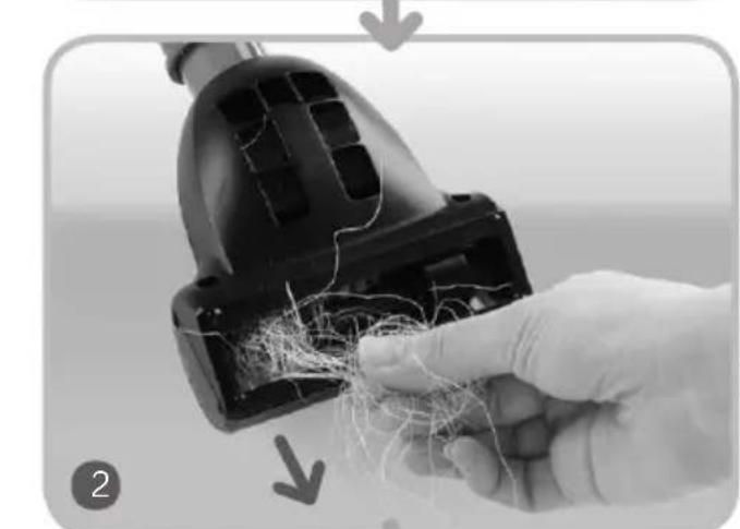 Close-up of a hand holding a vacuum cleaner with visible wiring and components (no text or symbols)