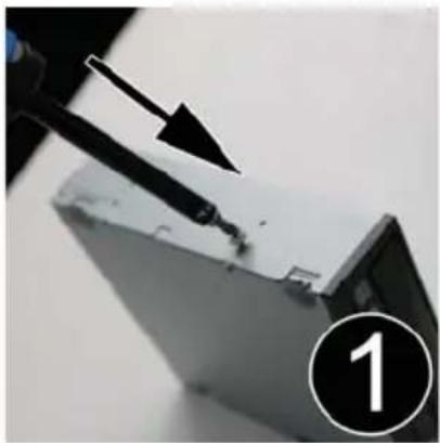 Close-up of a soldering iron on a metal surface with a black arrow pointing to the tip (no text or symbols visible)