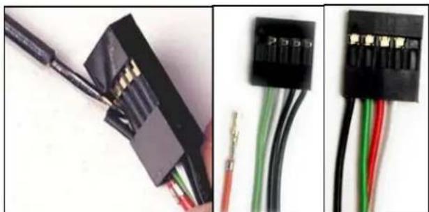 Close-up of three electronic components: a black connector with wires, a green connector, and a black terminal block (no visible text or symbols)