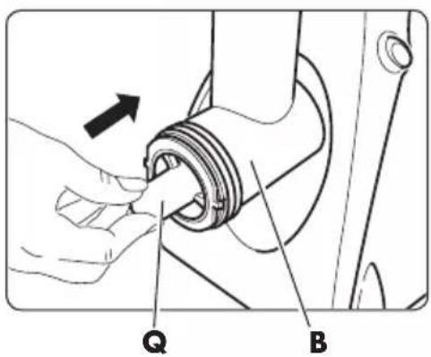 Technical diagram showing a hand fastening a mechanical component with labeled parts Q and B