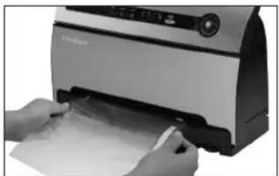 Person using a printer to press documents (no visible text or symbols)