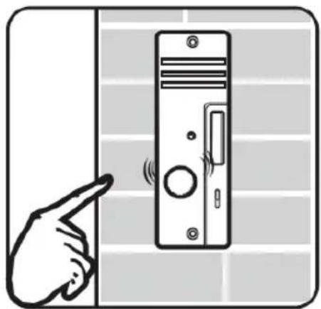 Illustration of a hand pointing at a wall-mounted computer monitor (no text or symbols visible)