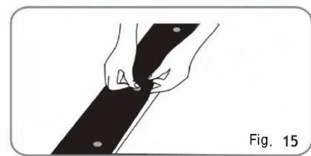 Illustration of hands holding a black object with circular holes, labeled 'Fig. 15' (no text or symbols on the diagram itself)